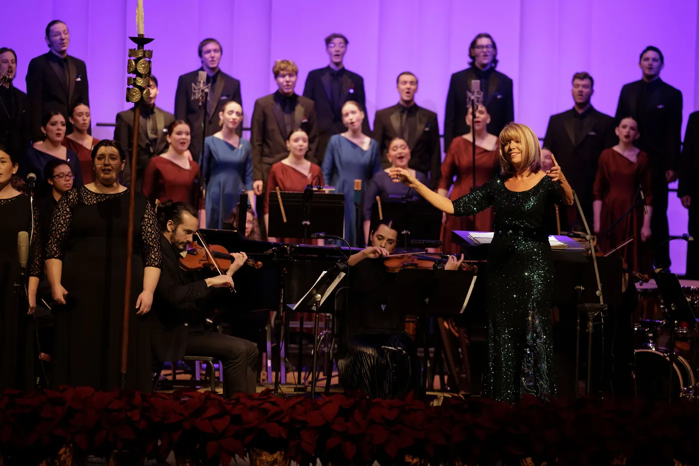 Lynda Hasseler conducting the choir and orchestra at the Christmas Festival